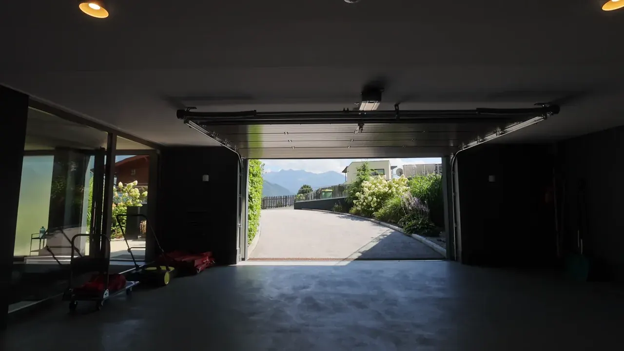 A home in Stanfield with a new dark garage door and clean panel lines